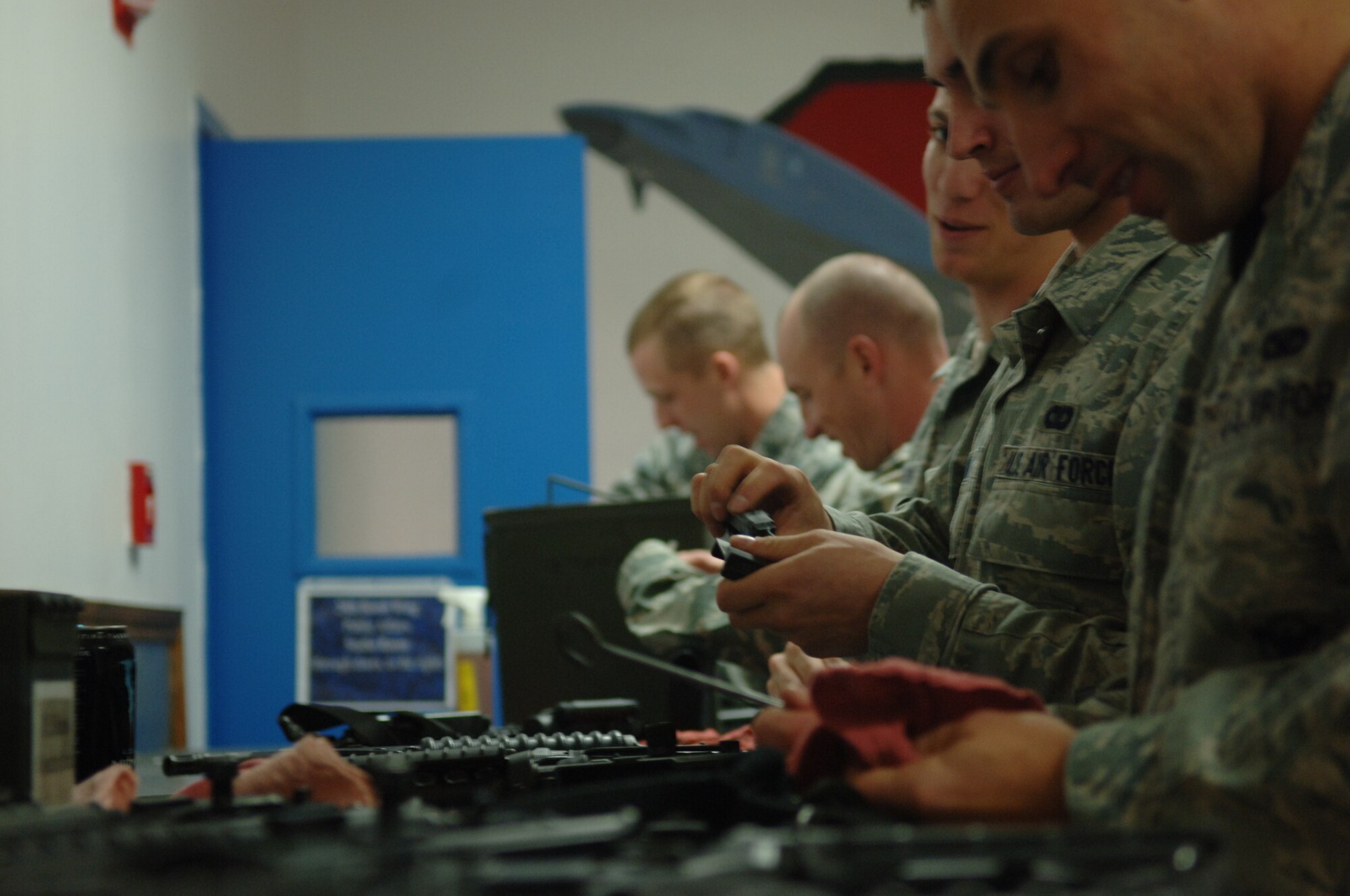 ELLSWORTH AIR FORCE BASE, S.D. – Airmen from the 28th Security Forces Squadron, having competed in the Global Strike Challenge at Barksdale Air Force Base, La., clean and inspect their weapons, Nov. 22. The team took second place against 10 other teams within their category. (U.S. Air Force photo/ Senior Airman Jarad A. Denton)