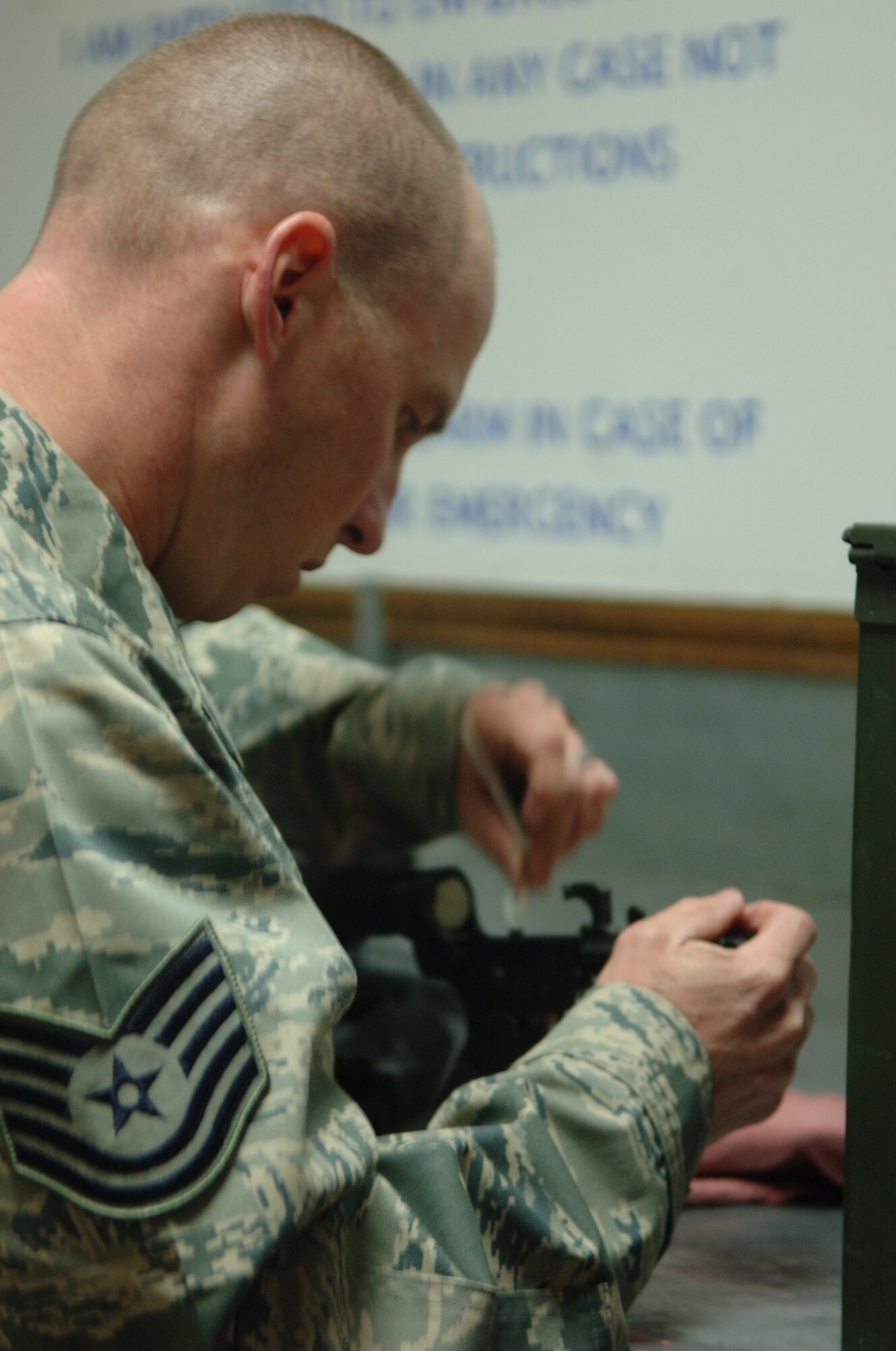 ELLSWORTH AIR FORCE BASE, S.D. – Tech. Sgt. Joseph Wengler, 28th Security Forces Squadron flight chief, cleans his M-4 carbine, Nov. 22. Sergeant Wengler’s seven-member team, which competed in the Global Strike Challenge at Barksdale Air Force Base, La., earned an overall second place in their category. (U.S. Air Force photo/ Senior Airman Jarad A. Denton)