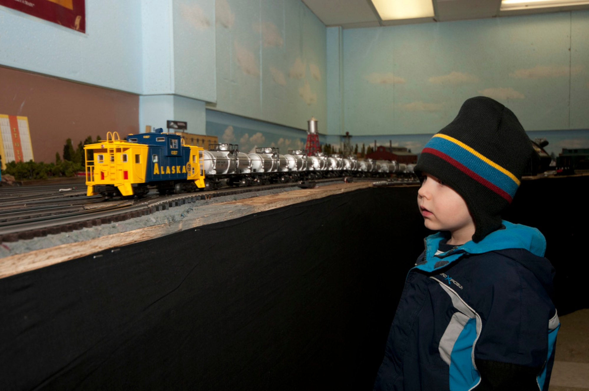 Gavyn Darnall watches a Lionel model train go by at the Military Society of Model Railroad Engineers. open house, Nov. 20, at Matanuska Hall. (Photo by Steve White/JBER PAO)