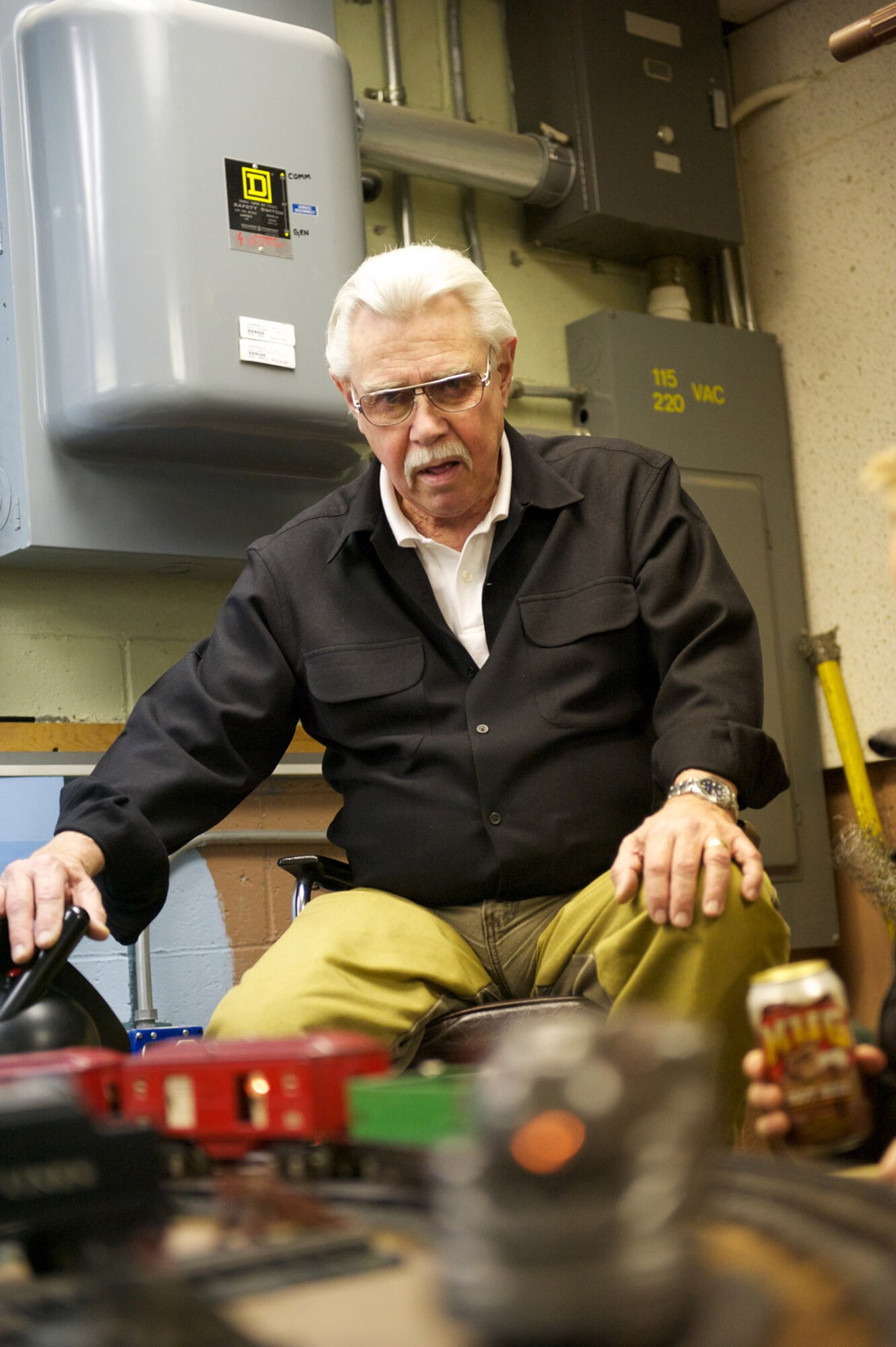 Bill Crawford, Lionel Collectors Club member, operates a 1930s-era steam locomotive model train, Nov. 20, at Matanuska Hall during a Military Society of Model Railroad Engineers open house. (Photo by David Bedard/JBER PAO)