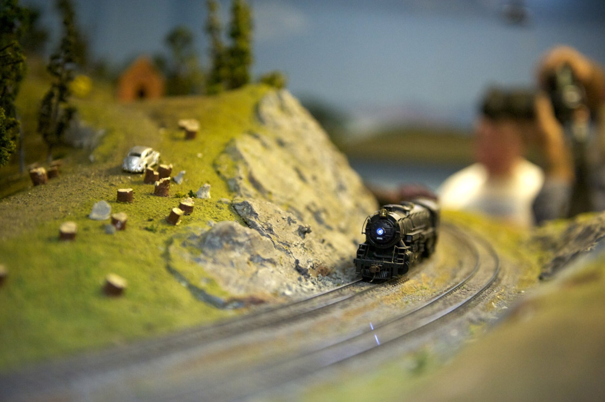 A model steam locomotive train makes its way through a Military Society of Model Railroad Engineers layout, Nov. 20, at Matanuska Hall. (Photo by David Bedard/JBER PAO)