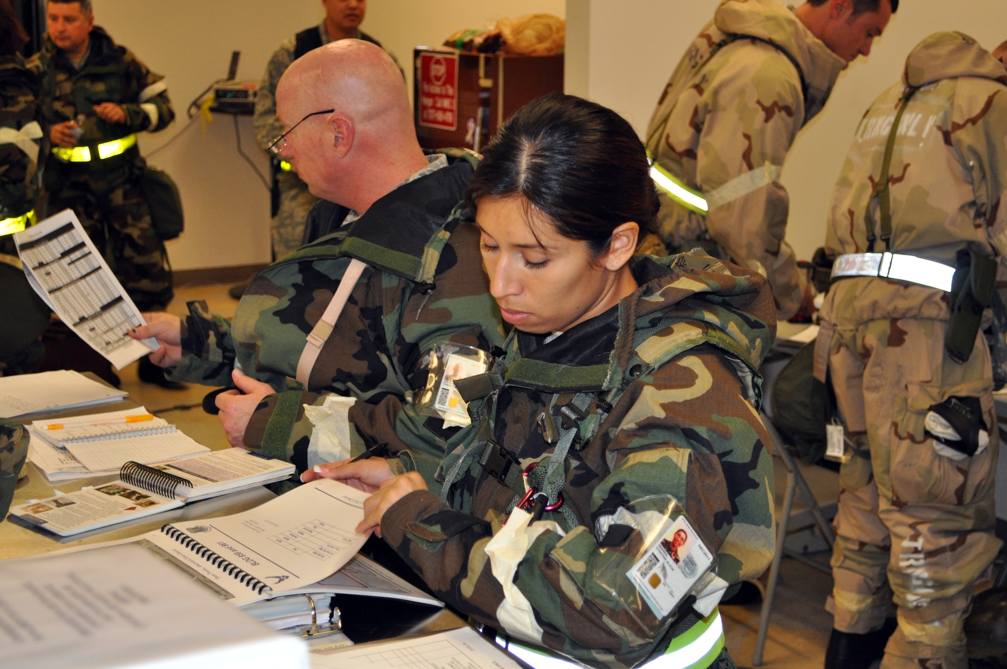TRAVIS AIR FORCE BASE, Calif. -- On the night shift during Exercise Crisis Look 10-07, the Emergency Operations Center was a hive of activity, with Reserve Airmen monitoring conditions and threat levels, studying their Airman's Manual, and making
sure they were ready for imminent attack. The 349th AMW teamed with the 60th
AMW for this first exercise of the cycle to prepare for the operational readiness inspection scheduled for January of 2013. (U.S. Air Force photo/Senior Master Sgt. Ellen Hatfield)