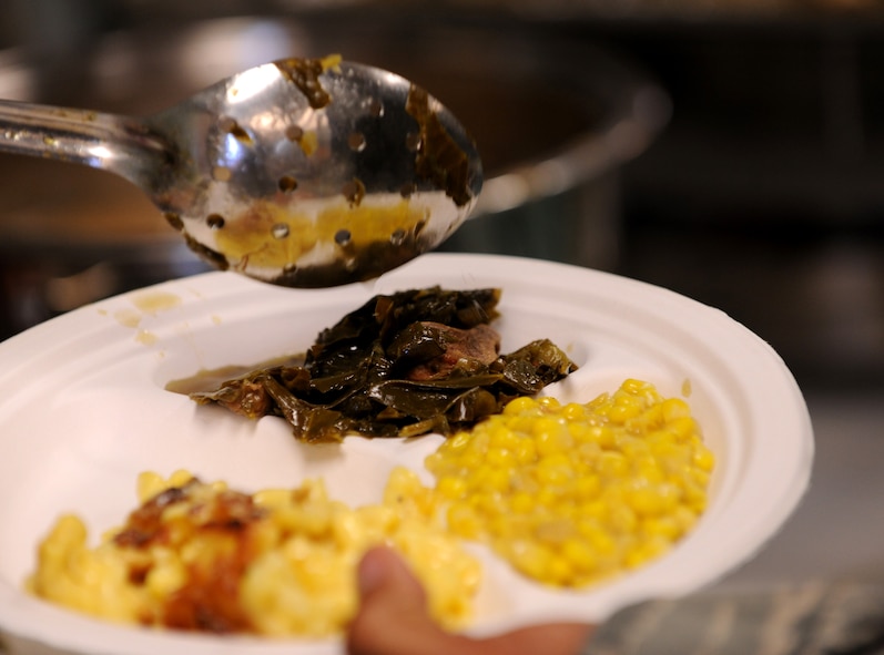 MOODY AIR FORCE BASE, Ga.-- Food is served to the Airmen by senior NCOs during the Airman’s Thanksgiving Luncheon Nov. 23. Airmen were served traditional Thanksgiving food by Moody’s chief master sergeants.  (U.S. Air Force photo/Airman 1st Class Benjamin Wiseman)(RELEASED)