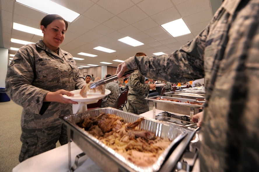 MOODY AIR FORCE BASE, Ga.-- Senior Airman Tiffani Sullivan, 823rd Base Defense Squadron member, goes through the serving line during the Airman’s Thanksgiving Luncheon Nov. 23. (U.S. Air Force photo/Airman 1st Class Benjamin Wiseman)(RELEASED)