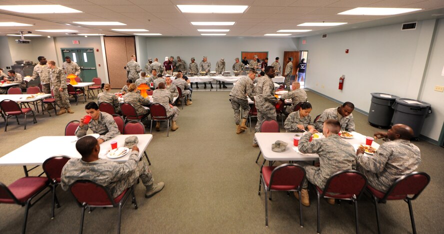 MOODY AIR FORCE BASE, Ga.-- Moody Airmen sit down to eat during the Airman’s Thanksgiving Luncheon Nov. 23. Ham, turkey, chicken and a wide variety of side dishes were served to the Airmen during the luncheon. (U.S. Air Force photo/Airman 1st Class Benjamin Wiseman)(RELEASED)