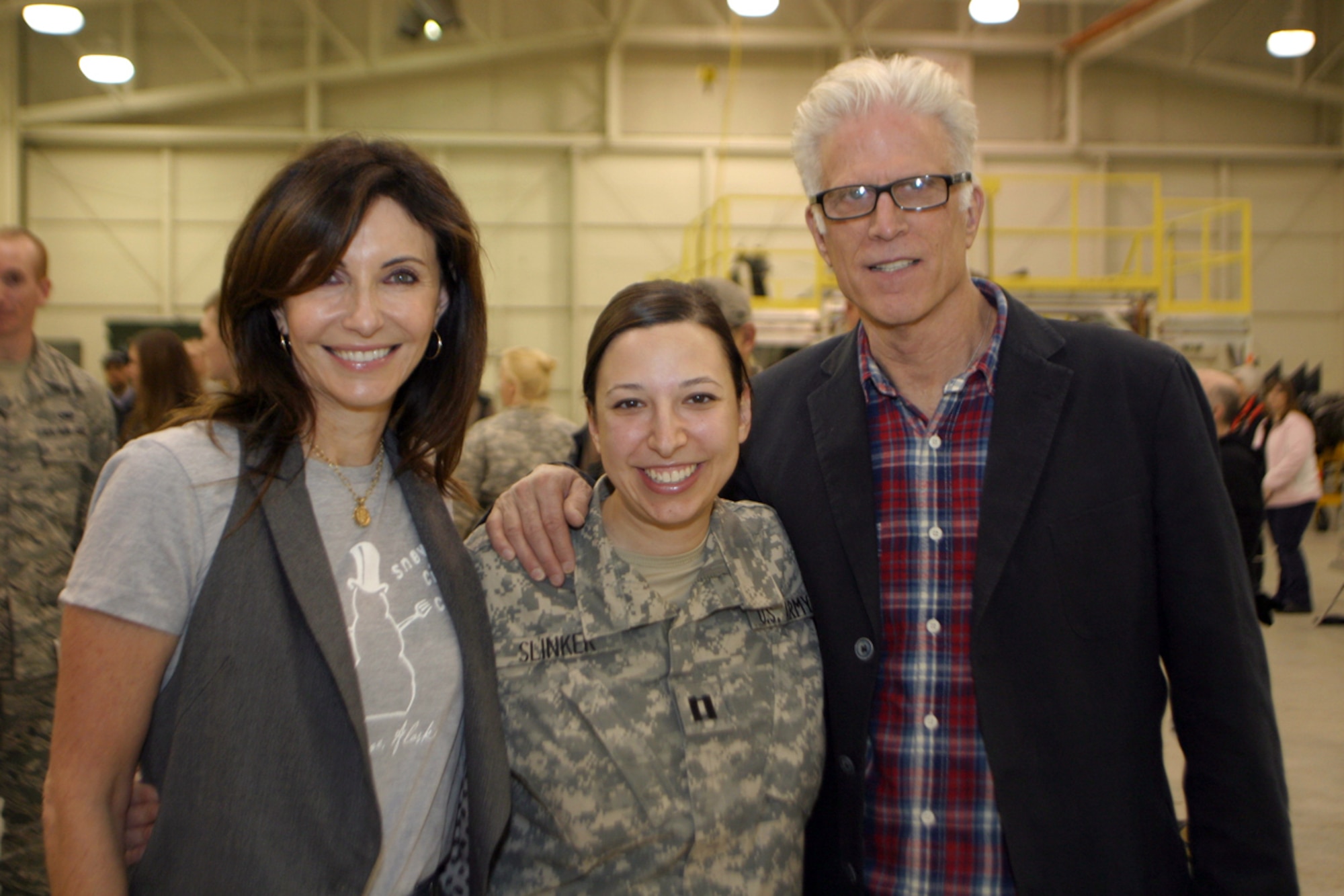 Army Capt. Amy Slinker, commander, 134th Public Affairs Detachment, Alaska Army National Guard, poses for a photo with Mary Steenburgen and Ted Danson during a meet and greet event held, Nov. 6. (Alaska National Guard photo/Maj. Guy Hayes)