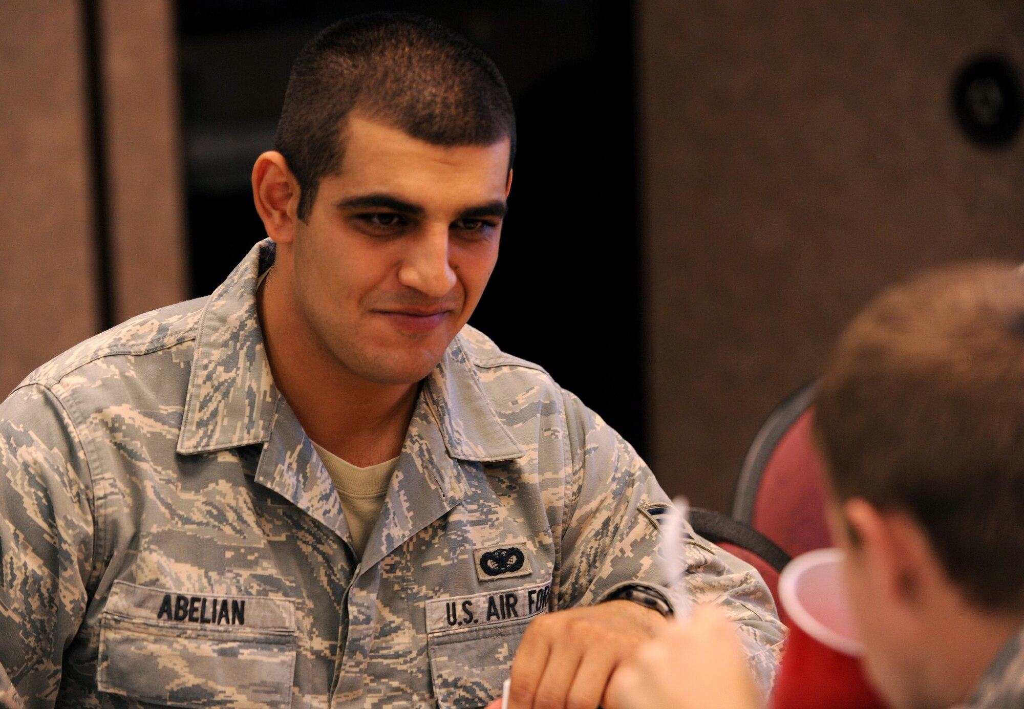 MOODY AIR FORCE BASE, Ga.-- Senior Airman Menva Abelian, 823rd Base Defense Squadron security forces member, enjoys a free lunch with his co-workers during the Airman’s Thanksgiving Luncheon Nov. 23. More than 300 Airmen came to the luncheon. (U.S. Air Force photo/Airman 1st Class Benjamin Wiseman)(RELEASED)