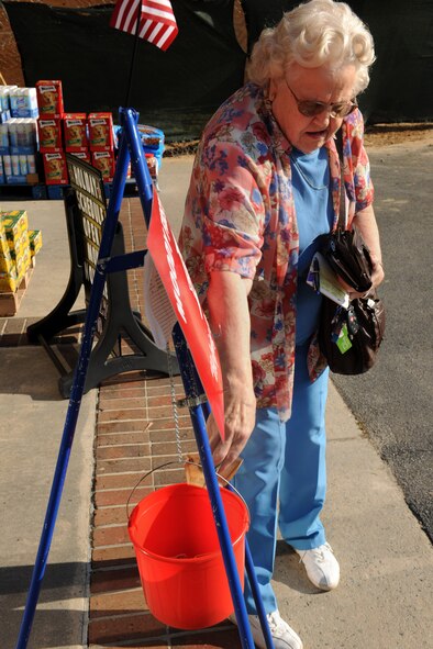 MOODY AIR FORCE BASE, Ga.-- Emma Rector, retired military spouse, donates money to the Moody’s First Sergeants Council before continuing her shopping Nov. 23. All donations to the Moody’s First Sergeants Council will be used to help less fortunate military families during the holiday season despite their financial situation. (U.S. Air Force photo/Airman 1st Class Benjamin Wiseman)(RELEASED)