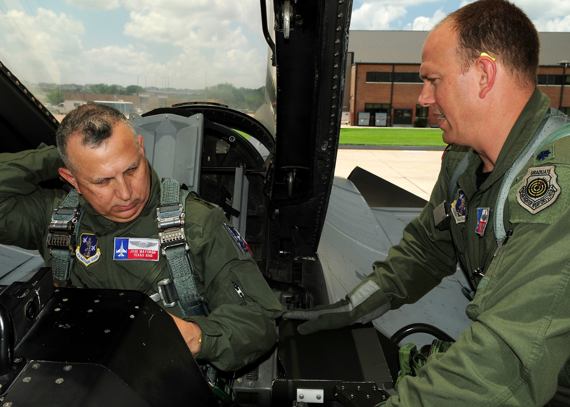 Lt Col Gordon Niebergall, right, briefs MG Jose Mayorga, the Adjutant General of Texas, prior to an orientation flight at the 149th Fighter Wing, Texas Air National Guard, 11 June 2010. Col Niebergall recently had the honor of taking part in a flyover in his hometown of Amarillo, Texas, as part of a dedication ceremony for a restored 149FW F-100 jet on permanent display at the Texas Panhandle War Memorial Park. (Air Force photo by SMSgt Mike Arellano/released)
