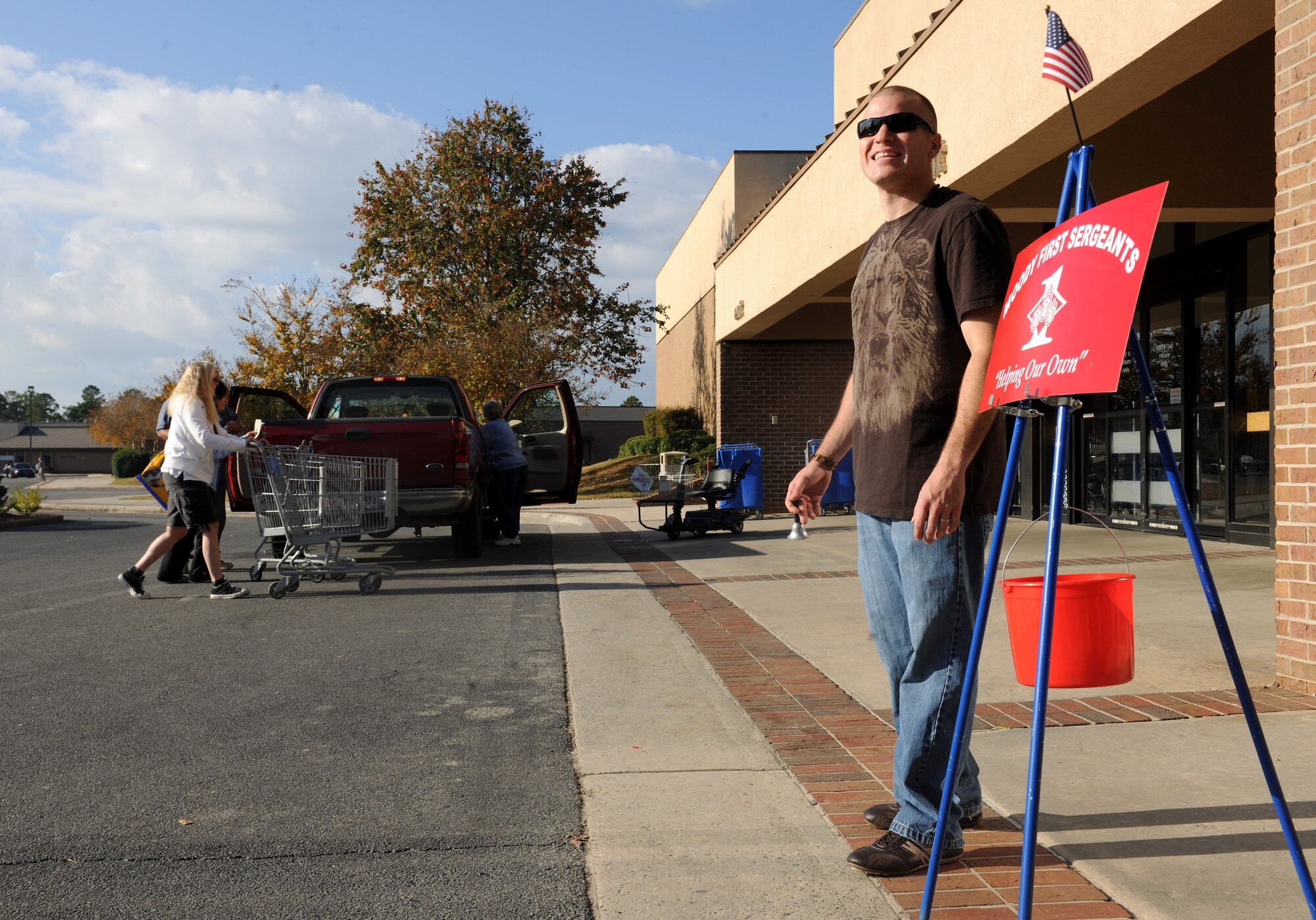 MOODY AIR FORCE BASE, Ga.-- Senior Airman Christian Franco, 23rd Component Maintenance Squadron test cell technician, takes donations outside the Commissary Nov. 23. The Moody’s First Sergeants Council will be taking donations this holiday season to assist less fortunate military families. (U.S. Air Force photo/Airman 1st Class Benjamin Wiseman)(RELEASED)