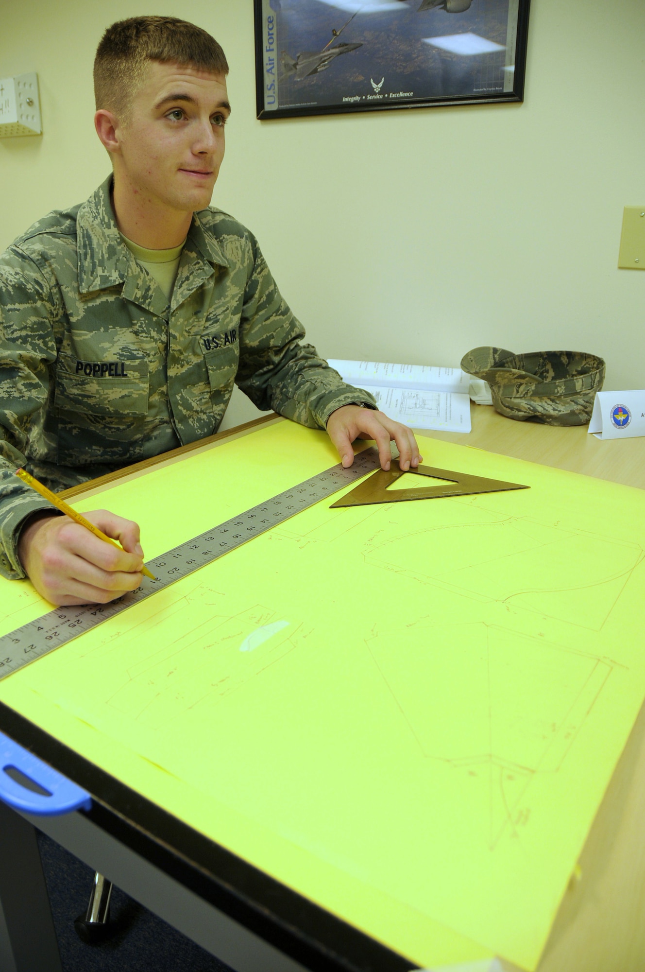 Airman 1st Class Zachery Poppell sketches schematics in the metals layout segment of
the Air Force unique segment of the course. (Photo by Airman 1st Class Heather Holcomb)