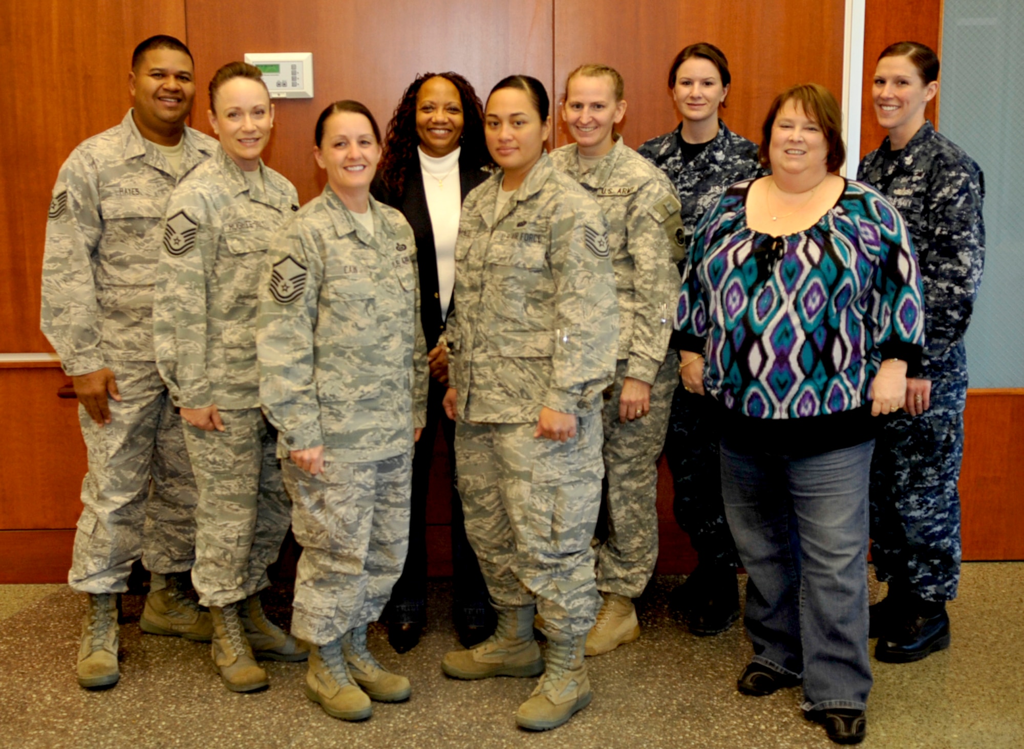 Buckley Victim Advocates Tech. Sgt. John Hayes, Master Sgt. Lisamichelle Hughes-Belt, Master Sgt. Karen Cain, Ms Peggy Moore-McCoy,TSgt Annie Fernandez, Maj. Alisa Englert, Petty Officer 1st Class Amanda McNeely, Ms. Tammy Jordan, Petty Officer 1st Class Erika Burrell pose for a photo on Nov 5, 2010. (Air Force Photo by Airman First Class Paul Labbe.)
