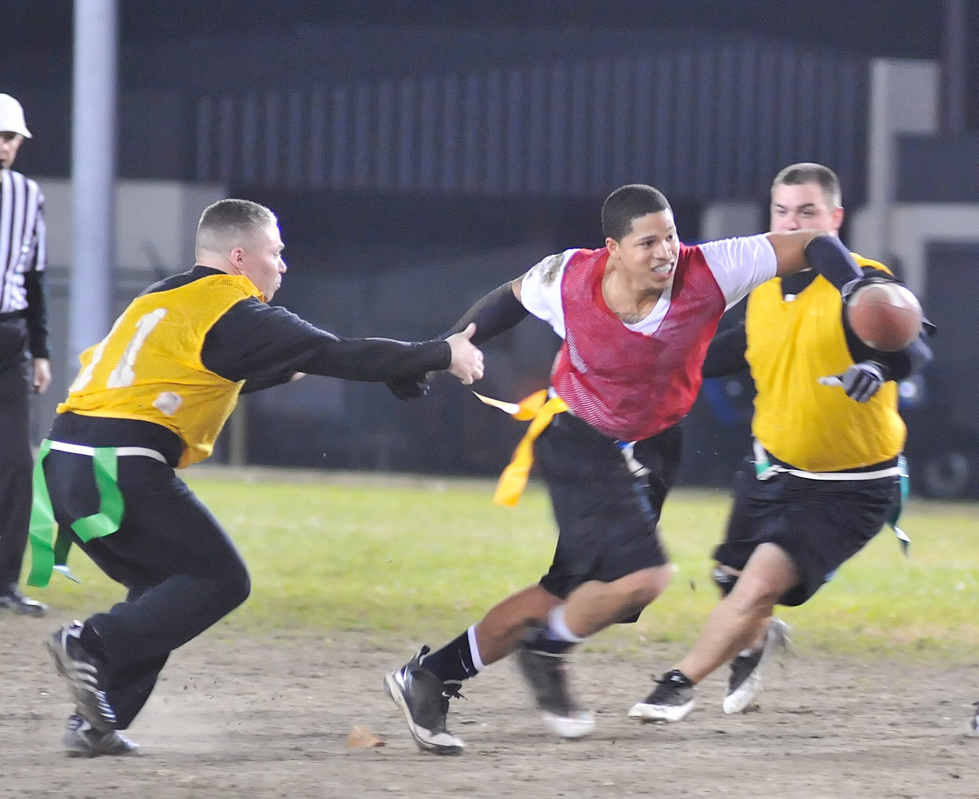 Wade Mcnair, American League, runs the ball down the field evading the National League Defense during the All Star League championship game Nov. 22, 2010. (U.S. Air Force photo by Airman 1st Class Matthew Hubby/Released)