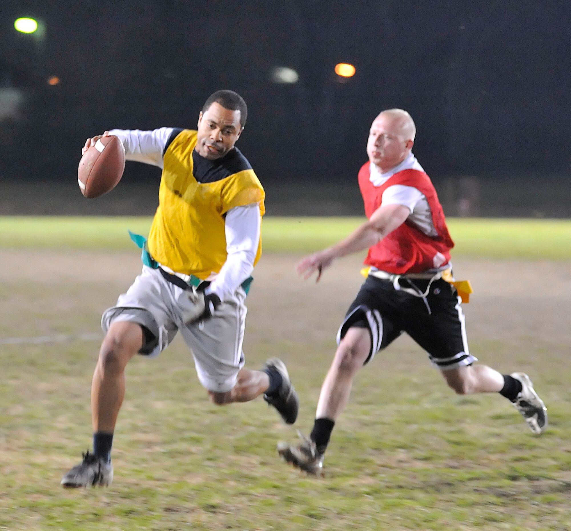 (Left) Shaun Williams, National League, runs for a touchdown during the All Star League championship game Nov. 22, 2010.  (U.S. Air Force photo by Airman 1st Class Matthew Hubby/Released)
