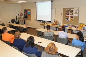 LANGLEY AIR FORCE BASE, Va. -- Maj. (Dr.) Hjalmar Contreras, podiatrist with 633d Medical Group, briefs members of Team Langley on preventive measures and symptoms of the various diabetic diseases Nov. 17. As the sole podiatrist on base, Doctor Contreras held the briefing in honor of Diabetes Awareness Month informing everyone on the risks of not taking care of yourself or a loved one. (U.S. Air Force photo/Staff Sgt. Ashley Hawkins)(RELEASED)