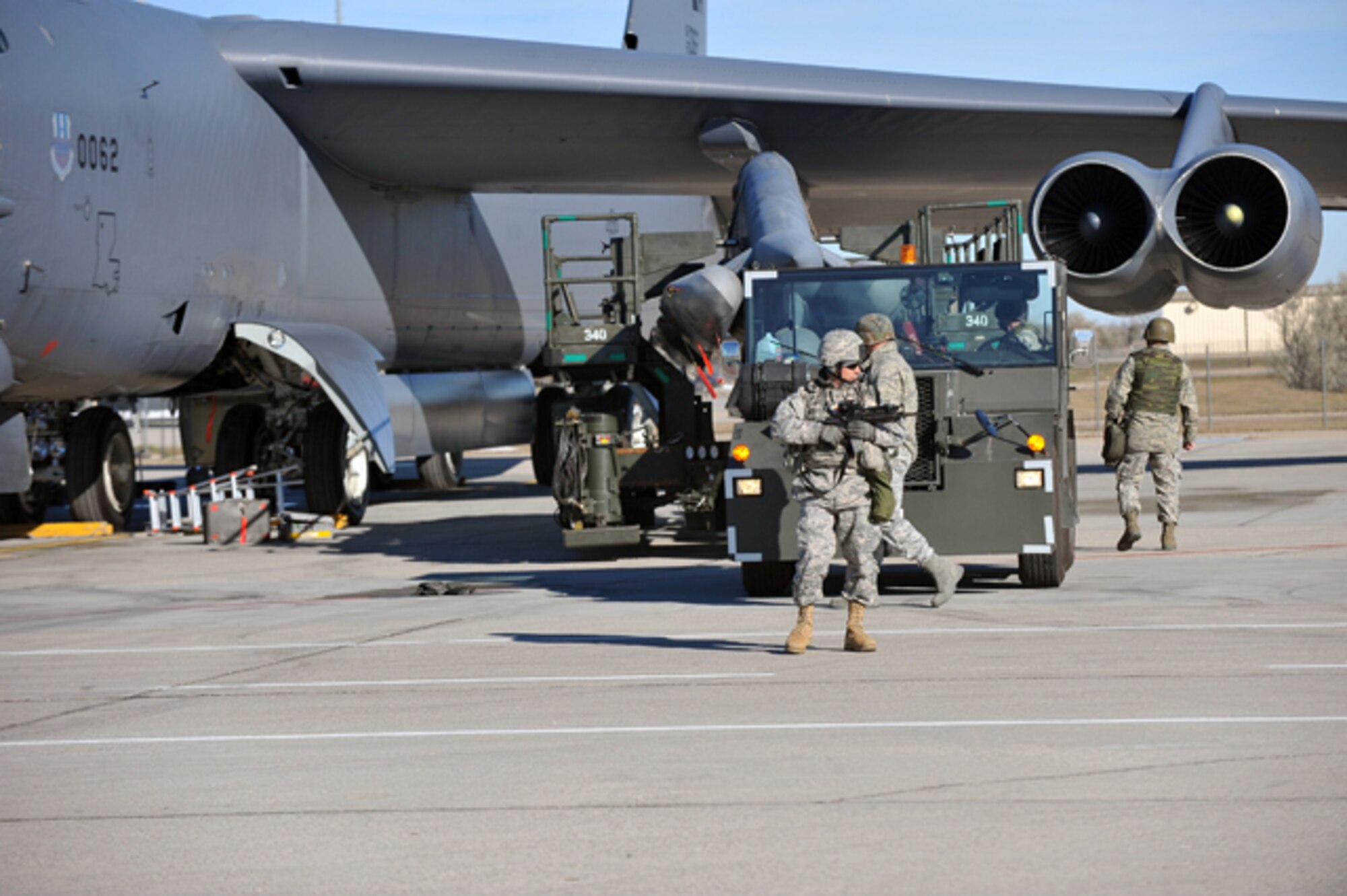 MINOT AIR FORCE BASE, N.D. -- Members of the 5th Security Forces Squadron escort a weapons convoy to the flight line as part of an Air Force Global Strike Command inspection here Nov. 4. AFGSC’s 5th Bomb Wing received a satisfactory rating after successfully completing its nuclear operational readiness inspection here Nov. 10. (U.S. Air Force photo/Senior Airman Michael J. Veloz)