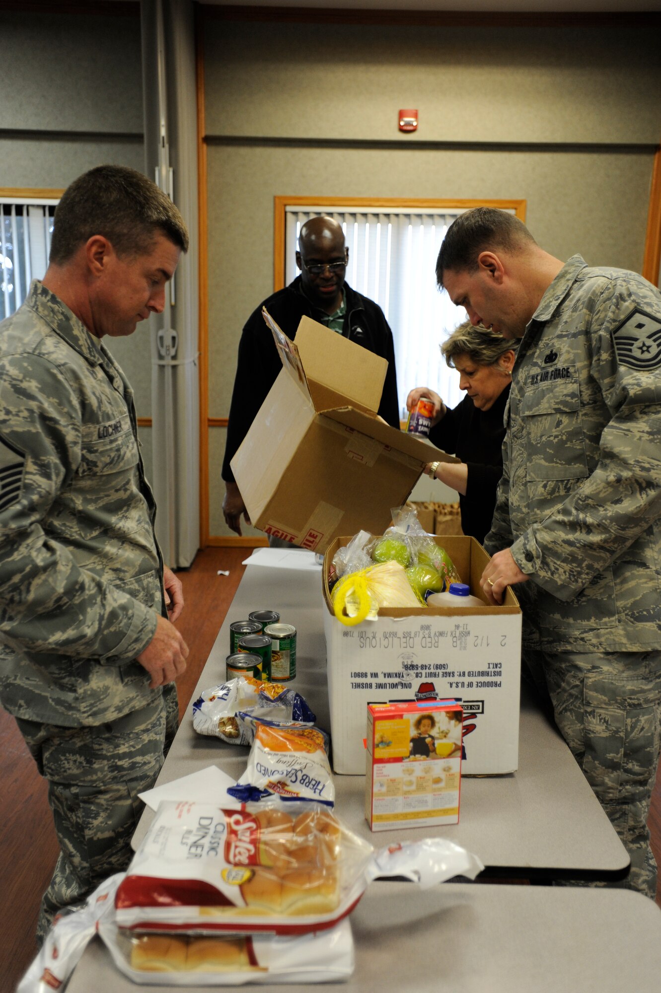 Team McConnell members built Thanksgiving Baskets to help Airmen and their families at the base chapel, Nov. 11, 2010, McConnell Air Force Base, Kan. The group was led by the Airman and Family Readiness Center, with the support of the commanders and First Sergeants. The baskets contained fruits, vegetables, turkeys and many more items to make a Thanksgiving meal.  (U.S. Air Force photo/Airman 1st Class Armando A. Schwier-Morales)