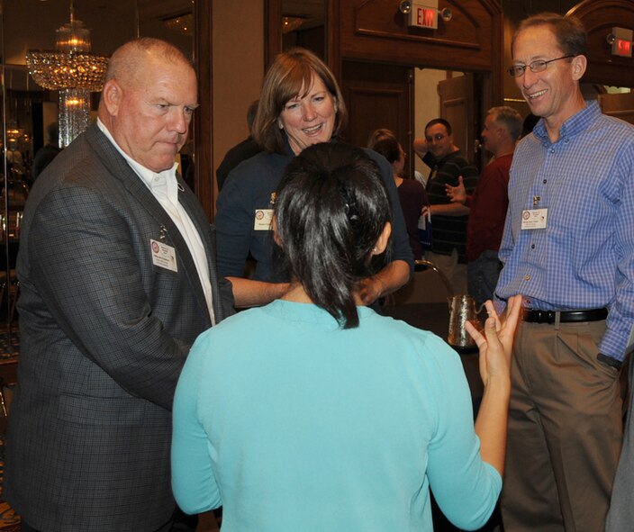 The spouse of a deploying Reservist chats with Chief Master Sgt. John Anderson (left), command chief, 94th Airlift Wing, Dobbins ARB; Maj. Gen. James Rubeor (right), commander, 22nd Air Force; and his wife, Mrs. Michele Rubeor Nov. 20, 2010 at the Yellow Ribbon Program, Memphis, Tenn. General and Mrs. Rubeor attended Yellow Ribbon to show their support and answer questions from Airmen and dependents. (U.S. Air Force photo by Senior Airman Anna-Marie Wyant)  