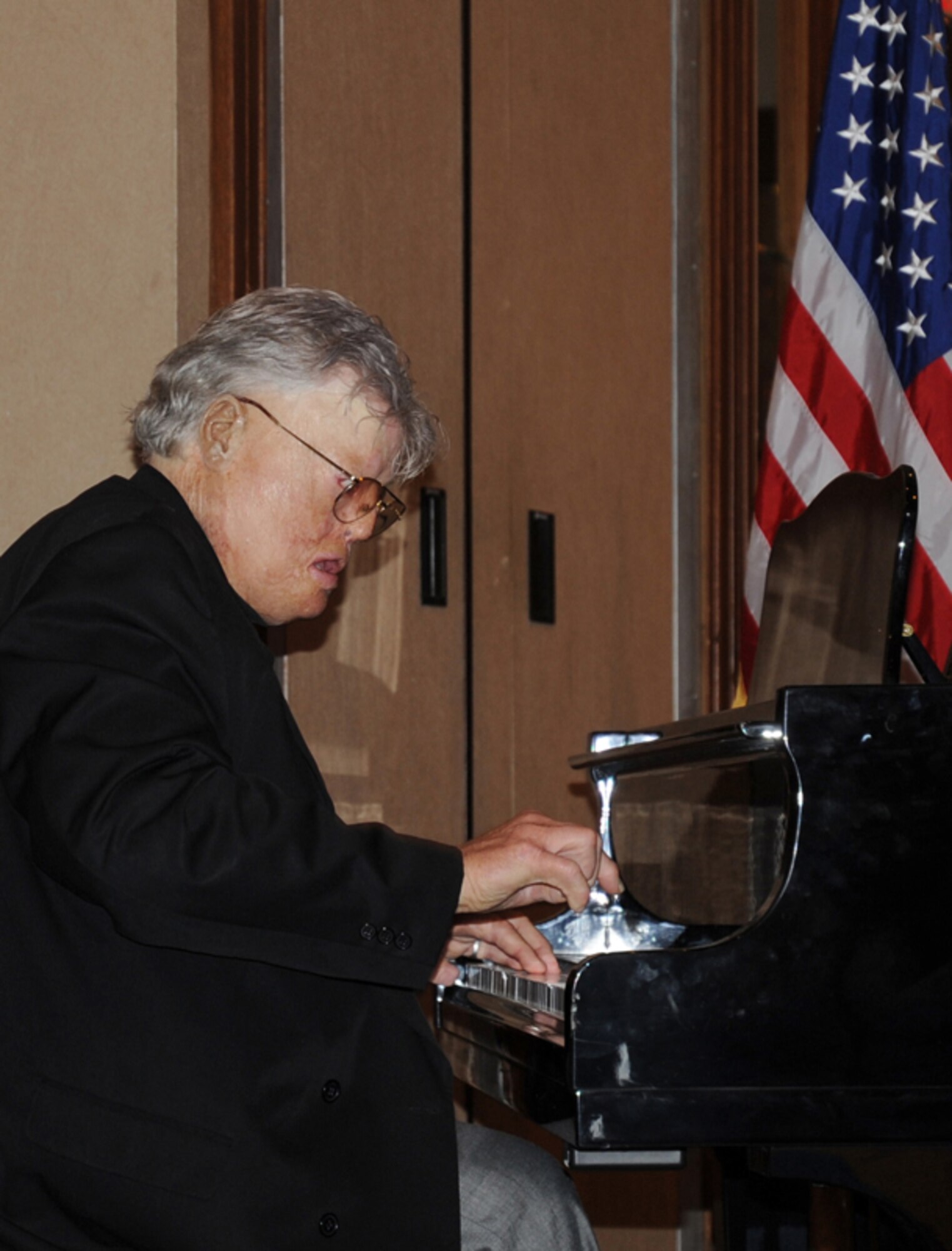 Mr. Dave Roever, a wounded Vietnam War veteran, plays “How Great Thou Art” on the piano at the Yellow Ribbon Program at the Hilton Memphis Hotel, Memphis, Tenn., Nov. 20, 2010. Mr. Roever, the guest speaker at the event, has donated much of his own time and money to support wounded warriors for several years. (U.S. Air Force photo by Senior Airman Anna-Marie Wyant) 