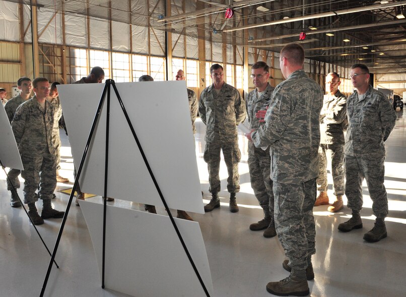 SHAW AIR FORCE BASE, S.C. -1st Lt. Bernard Conrad (front right), 20th Equipment Maintenance Squadron, briefs Maj. Gen. Stephan Hoog (right center), 9th Air Force commander, Col. Charles Moore (center), 20th Fighter Wing commander, Lt. Col. James Smith (right left), 20th Equipment Maintenance Squadron, Col. Steven Bleymaier (right), 20th Maintenance Group commander, and Airmen from the 20th EMS, Shaw Air Force Base, S.C., Nov. 19, 2010. General Hoog and Command Chief Master Sgt. Robert Brooks, 9th Air Force command chief, took an official tour of the 20th Fighter Wing to gain insight into the mission and speak with Airmen from units across the base to hear their concerns. (U.S. Air Force photo/Airman 1st Class Amber E. N. Jacobs (Released))