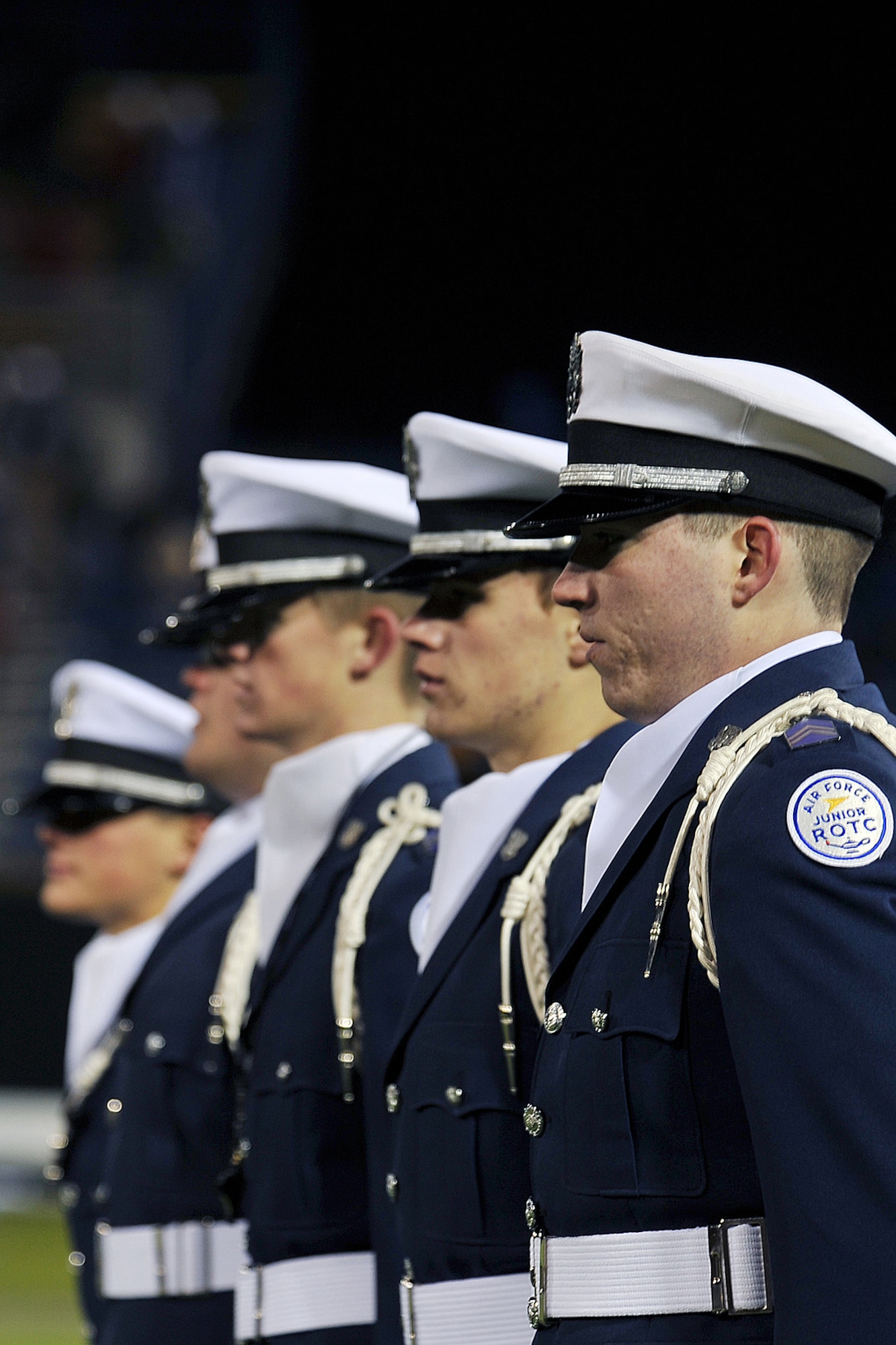 OFFUTT AIR FORCE BASE, Neb. - The Bellevue West High School Air Force Junior ROTC drill team performs drill movements during the Omaha Nighthawks military appreciation game at the Rosenblatt Stadium Nov. 19. Military members from all branches were celebrated at the game, which ended with a Florida Tuskers win 27 to 10.U.S. Air Force Photo by Charles Haymond (Released)