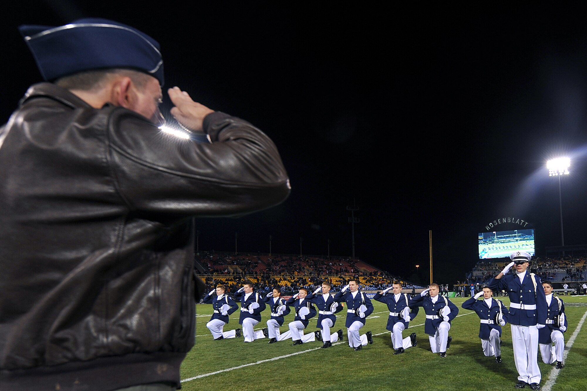 OFFUTT AIR FORCE BASE, Neb. - The Bellevue West High School Air Force Junior ROTC drill team salutes Brig. Gen. John N.T. Shanahan, 55th Wing commander, before exiting the football  field during the Omaha Nighthawks military appreciation game at the Rosenblatt Stadium Nov. 19. Military members from all branches were celebrated at the game, which ended with a Florida Tuskers win 27 to 10.U.S. Air Force Photo by Charles Haymond (Released) 