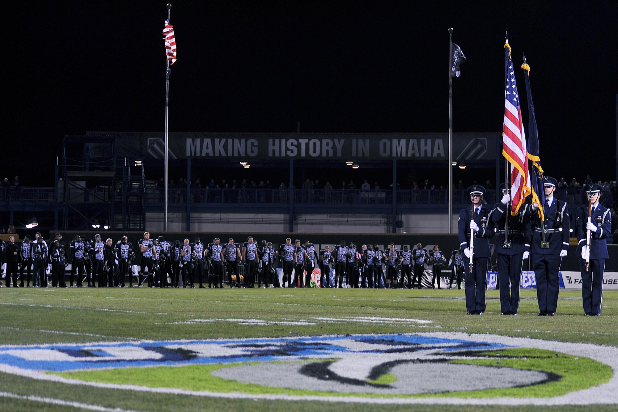 OFFUTT AIR FORCE BASE, Neb. - The 55th Wing Base Honor Guard posts the colors during the Omaha Nighthawks military appreciation game at the Rosenblatt Stadium Nov. 19. Military members from all branches were celebrated at the game, which ended with a Florida Tuskers win 27 to 10. U.S. Air Force Photo by Charles Haymond (Released)