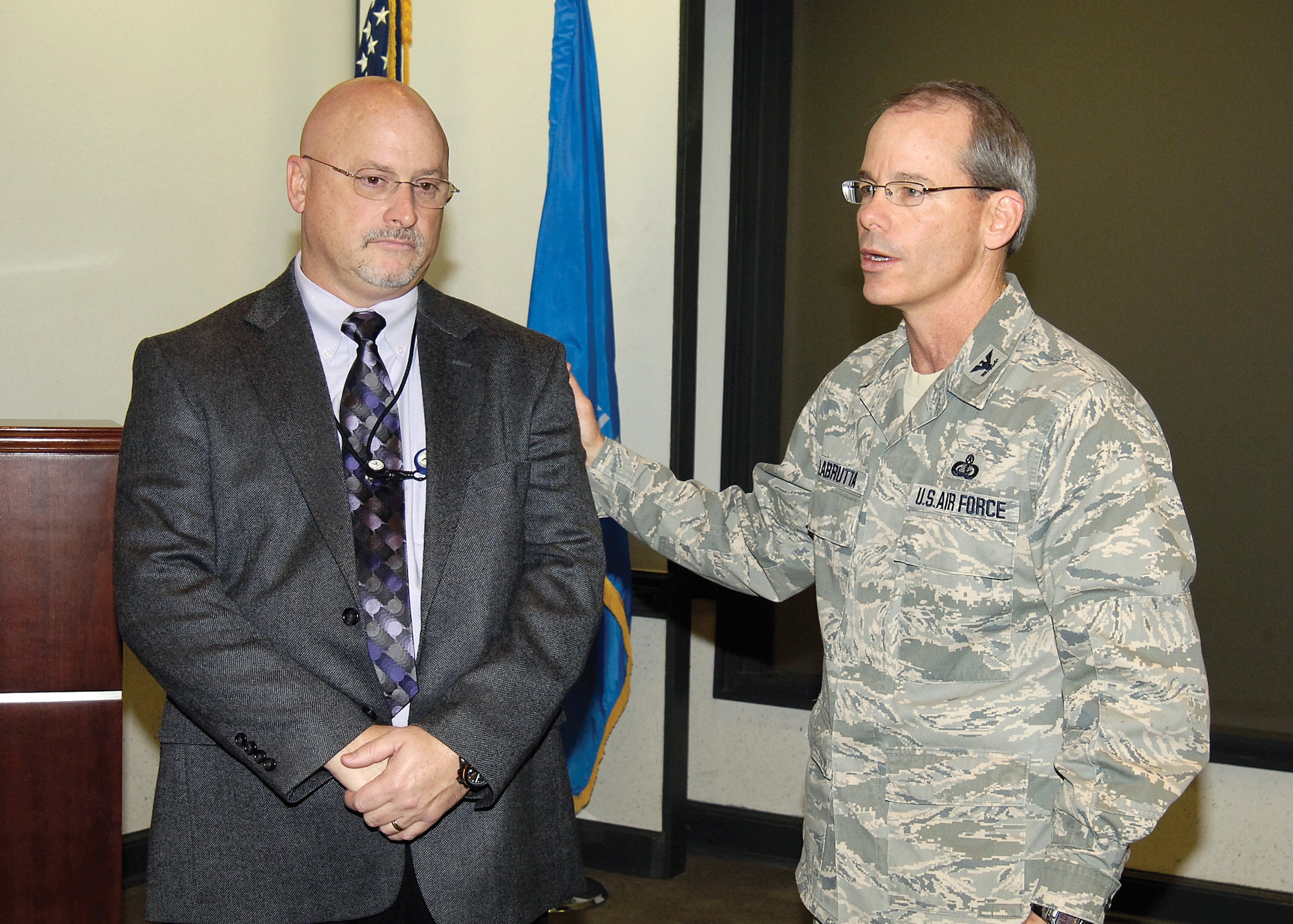 Dave Fralish, branch chief of the 72nd Communications Directorate Chief Information Officer Support Branch, exemplified a true Wingman attitude for a co-worker recently.  Drawing praise from the 72nd Air Base Wing and Tinker Installation Commander, Col. Bob LaBrutta, Mr. Fralish was presented with a Wingman Coin in front of the wing senior leadership Nov. 17. (Air Force photo by Margo Wright)