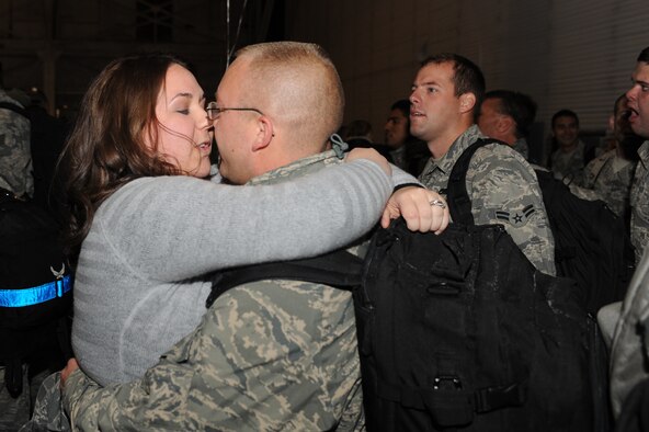MINOT AIR FORCE BASE, N.D. -- Airmen are greeted in a grand fashion by their families during the re-deployment here Nov. 20. These Airmen arrived from their deployment to Andersen AFB, Guam, as part of U.S. Pacific Command’s Continuous Bomber Presence. (U.S. Air Force photo/Airman 1st Class Aaron-Forrest Wainwright)