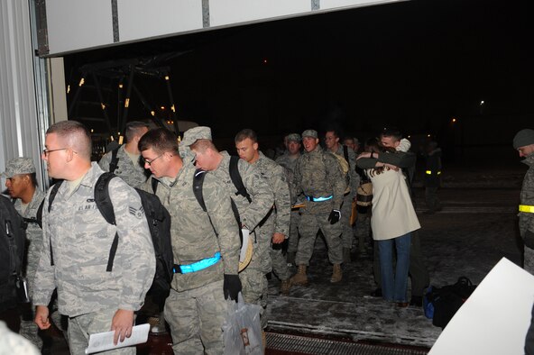 MINOT AIR FORCE BASE, N.D. -- Airmen are greeted in a grand fashion by their families during the re-deployment here Nov. 20. These Airmen arrived from their deployment to Andersen AFB, Guam, as part of U.S. Pacific Command’s Continuous Bomber Presence. (U.S. Air Force photo/Airman 1st Class Aaron-Forrest Wainwright)