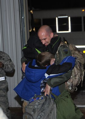 MINOT AIR FORCE BASE, N.D. -- Airmen are greeted in a grand fashion by their families during the re-deployment here Nov. 20. These Airmen arrived from their deployment to Andersen AFB, Guam, as part of U.S. Pacific Command’s Continuous Bomber Presence. (U.S. Air Force photo/Airman 1st Class Aaron-Forrest Wainwright)