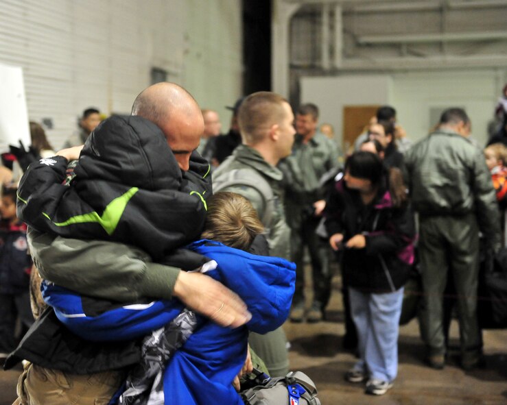 MINOT AIR FORCE BASE, N.D. -- Airmen are greeted in a grand fashion by their families during the re-deployment here Nov. 20. These Airmen arrived from their deployment to Andersen AFB, Guam, as part of U.S. Pacific Command’s Continuous Bomber Presence. (U.S. Air Force photo/Senior Airman Michael J. Veloz)