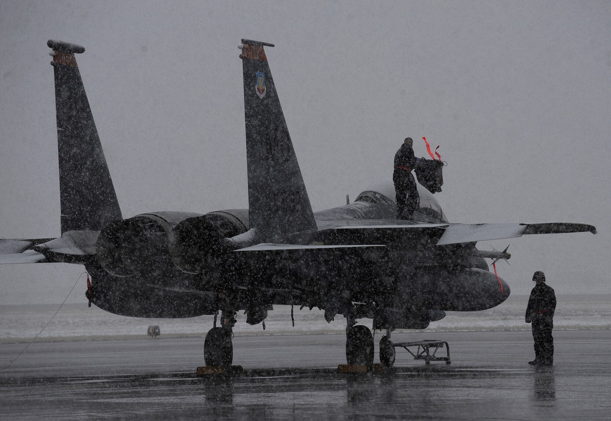 MOUNTAIN HOME AIR FORCE BASE, Idaho -- Airmen from the 366th Aircraft Maintenance Squadron continue working under harsh weather conditions during a phase I operational readiness exercise Nov. 22. The wing uses OREs to gauge its ability to meet wartime taskings at a deployed location. The evaluation includes initial response, readiness, combat operations, ability to survive and operate, self aid and buddy care and mission support. (U.S. Air Force photo by Senior Airman Renishia Richardson)