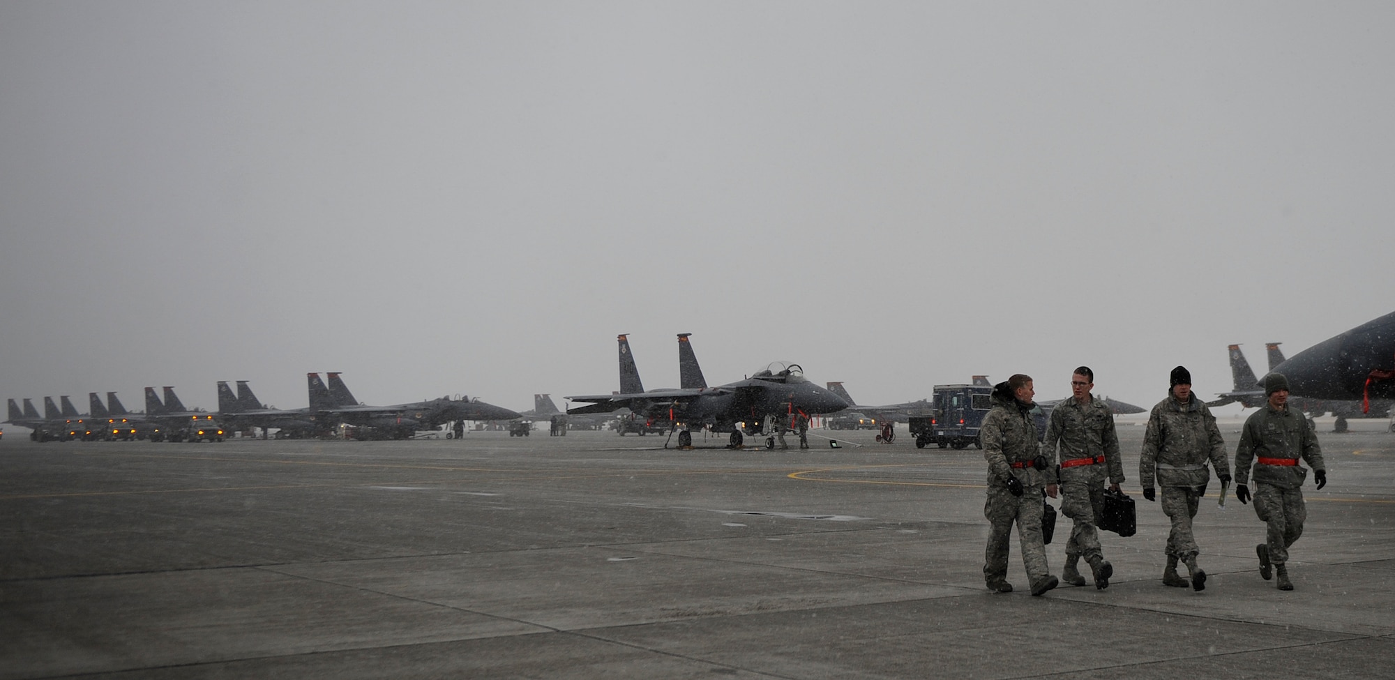 MOUNTAIN HOME AIR FORCE BASE, Idaho -- Airmen from the 366th Aircraft Maintenance Squadron leave the flightline after performing maintenance on an F-15E Strike Eagle during a phase I operational readiness exercise Nov. 22. The wing uses OREs to gauge its ability to meet wartime taskings at a deployed location. The evaluation includes initial response, readiness, combat operations, ability to survive and operate, self aid and buddy care and mission support. (U.S. Air Force photo by Senior Airman Renishia Richardson)