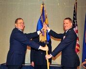 MINOT AIR FORCE BASE, N.D. -- Col. Troy Van Bemmelen, 5th Operations Group commander, assumes command from Col. Douglas Cox, 5th Bomb Wing commander, during a change of command ceremony here Nov. 19. (U.S. Air Force photo/Senior Airman Michael J. Veloz)
