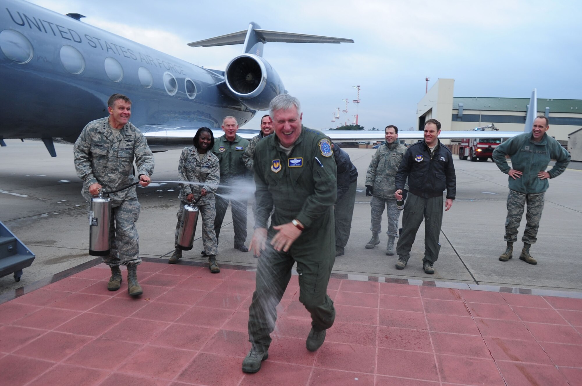 U.S. Air Force General Roger Brady, U.S. Air Forces in Europe commander, is sprayed with water after completing his final flight as a pilot in the U.S. Air Force, Ramstein Air Base, Germany, Nov. 23, 2010. Gen. Brady began his flight training in 1972, and has more than 3,000 hours of flight time in various air frames. (U.S. Air Force photo by Senior Airman Brittany Nicole Perry)