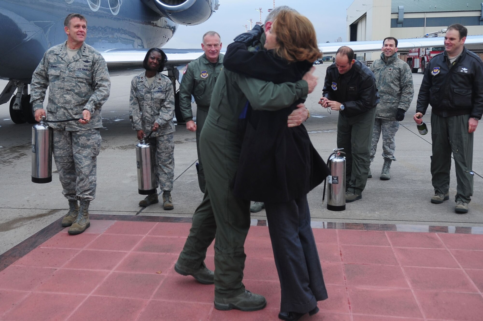 U.S. Air Force General Roger Brady, U.S. Air Forces in Europe commander, hugs his wife Litha Brady, after completing his final flight as a pilot in the U.S. Air Force, Ramstein Air Base, Germany, Nov. 23, 2010. Gen. Brady began his flight training in 1972, and has more than 3,000 hours of flight time in various air frames. (U.S. Air Force photo by Senior Airman Brittany Nicole Perry)