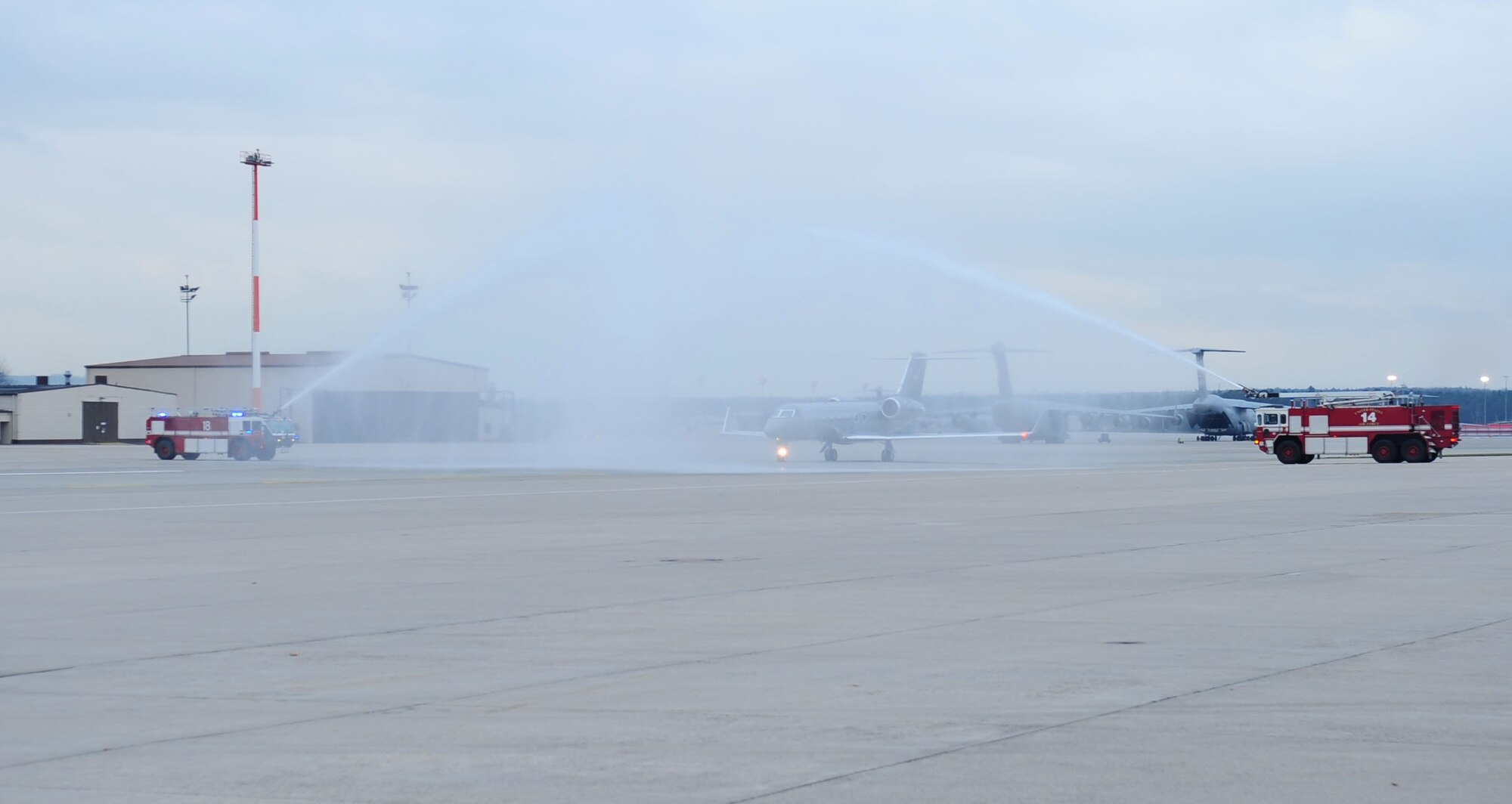 A C-20 piloted by U.S. Air Force General Roger Brady, U.S. Air Forces in Europe commander, taxies under pressured water from two Ramstein fire trucks during his final flight as a pilot in the U.S. Air Force, Ramstein Air Base, Germany, Nov. 23, 2010. Gen. Brady began his flight training in 1972, and has more than 3,000 hours of flight time in various air frames. (U.S. Air Force photo by Senior Airman Brittany Nicole Perry)