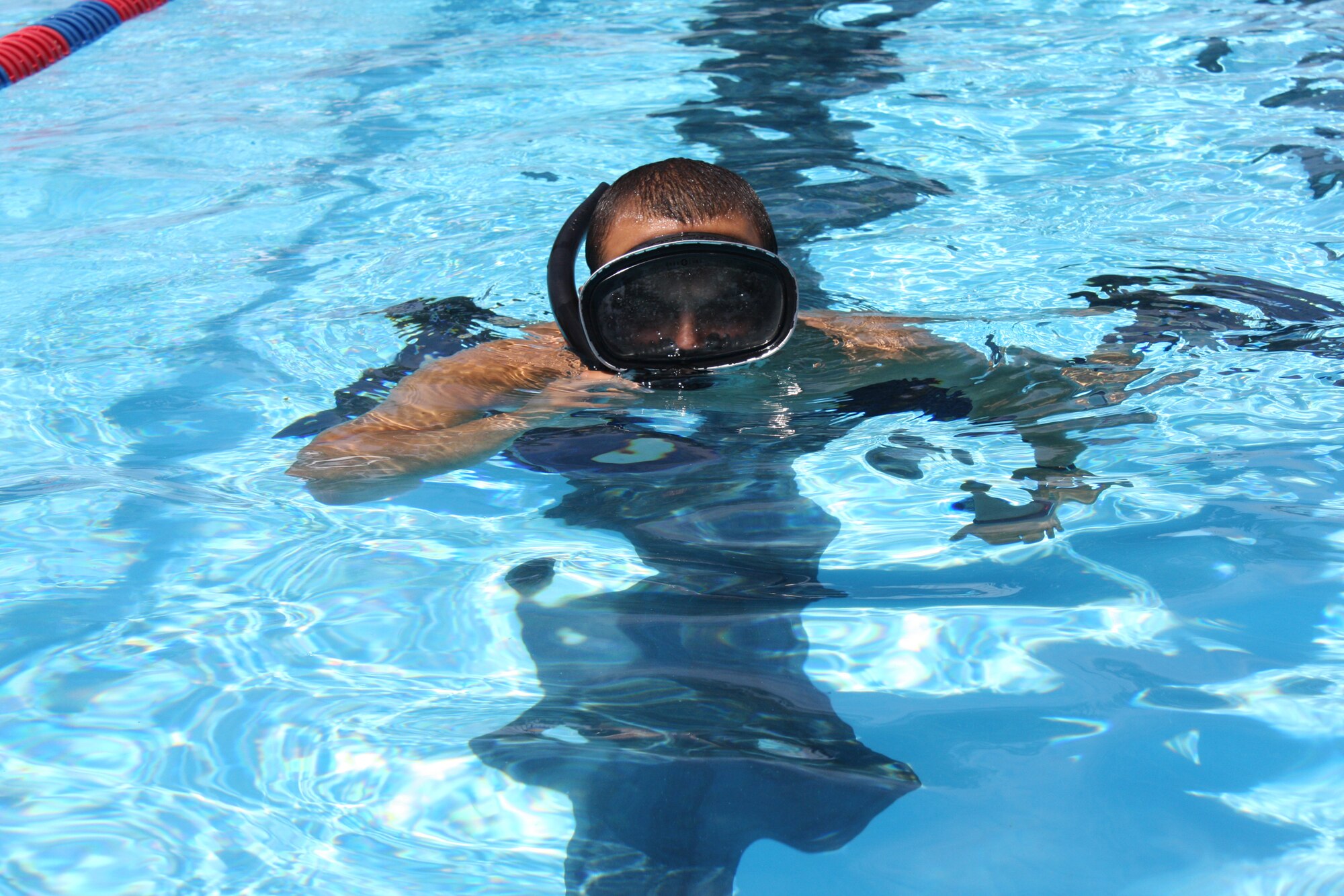WRIGHT-PATTERSON AIR FORCE BASE, Ohio - Senior Airman Eddie Mulkey, 445th Aeromedical Evacuation Squadron, prepares for his final Air Force Special Operations Command Physical Ability Stamina Test by swimming at the base pool back in July at Wright-Patterson Air Force Base, Ohio. Sergeant Mulkey found out in August that he was selected to join the USAF Pararescuemen. (U.S. Air Force photo/Staff Sgt. Robert Nelson)