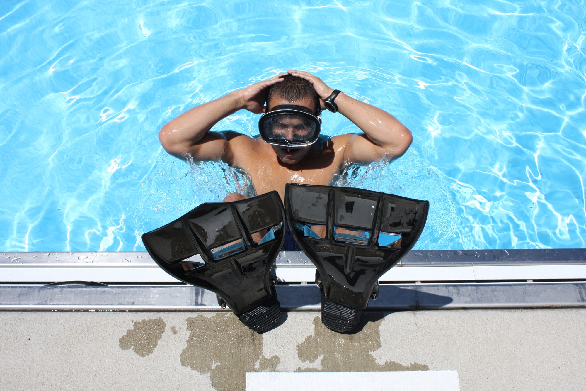 WRIGHT-PATTERSON AIR FORCE BASE, Ohio - Senior Airman Eddie Mulkey, 445th Aeromedical Evacuation Squadron, prepares for his final Air Force Special Operations Command Physical Ability Stamina Test by swimming at the base pool back in July at Wright-Patterson Air Force Base, Ohio. Sergeant Mulkey found out in August that he was selected to join the USAF Pararescuemen. (U.S. Air Force photo/Staff Sgt. Robert Nelson)