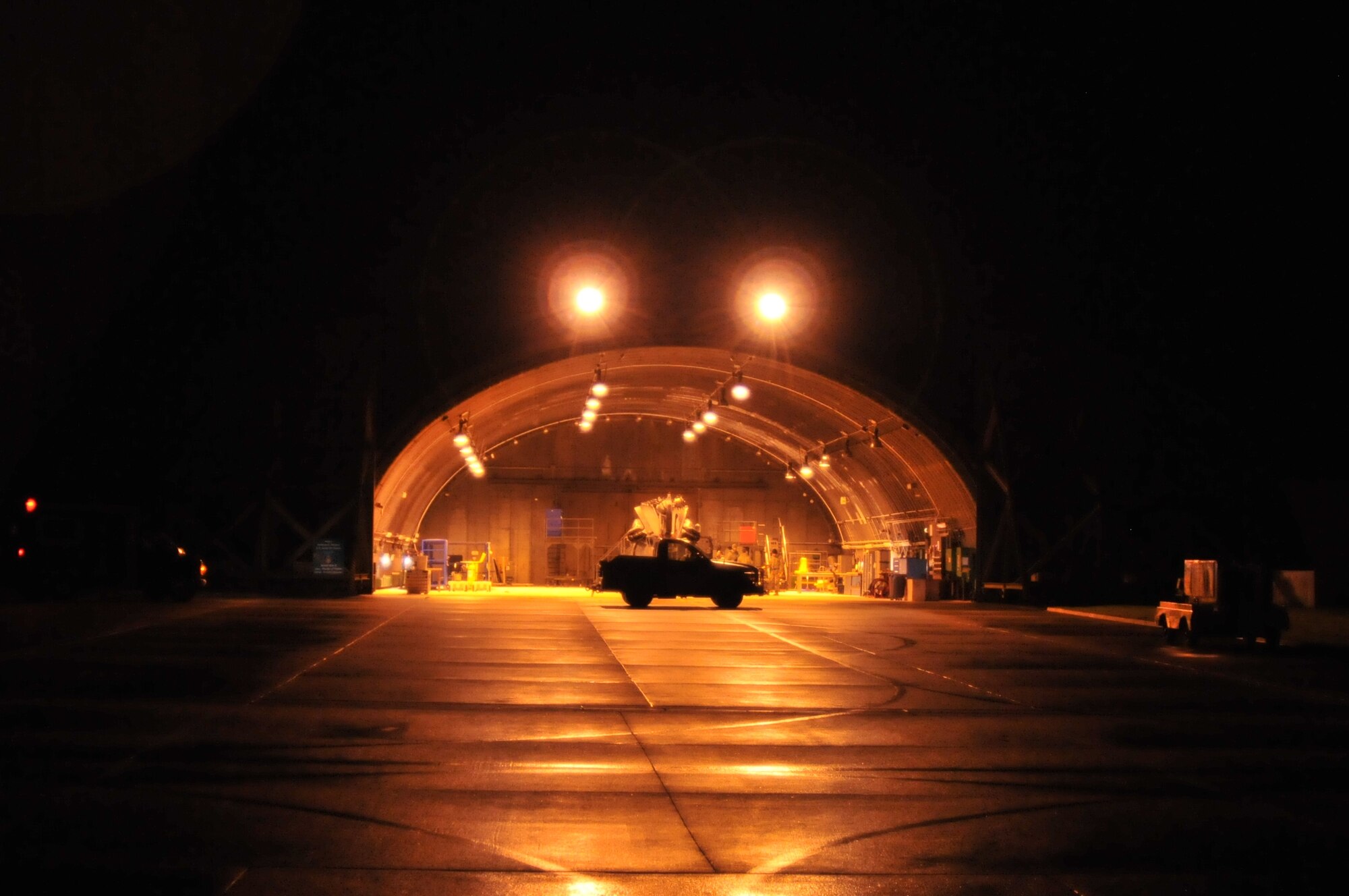 ROYAL AIR FORCE LAKENHEATH, England -- An HH-60G Pave Hawk helicopter waits inside its hangar on the Lakenheath flightline Nov. 22. The helicopter has its rotors and tail folded in preparation for loading aboard a C-17 Globemaster III for deployment to Afghanistan (U.S. Air Force photo/Senior Airman David Dobrydney)