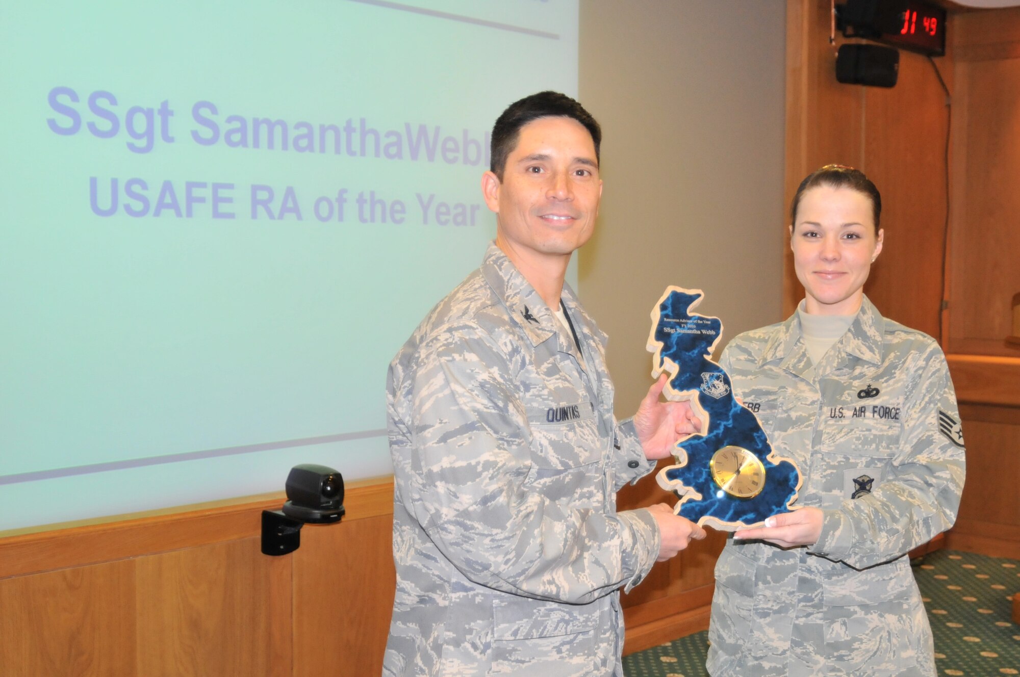 ROYAL AIR FORCE LAKENHEATH, England -- Col. John Quintas, 48th Fighter Wing commander, presents an award to Staff Sgt. Samantha Webb, 48th Security Forces Squadron resource advisor, in the 48th FW headquarters Nov. 23. Sergeant Webb has been named Resource Advisor of the year for United States Air Forces in Europe. (U.S. Air Force photo/Senior Airman David Dobrydney)