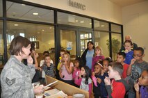LAUGHLIN AIR FORCE BASE, Texas – Staff Sgt. Lynnette Pace, a dental hygienist for the 47th Medical Operations Squadron, teaches children from Laughlin’s Youth Center how to do a personal oral cancer screening. The free oral cancer screening booth was set up in the Health and Wellness Center as part of the Great American Smokeout event Nov. 18. ( U.S. Air Force photo by 2nd Lt. Angela Martin)