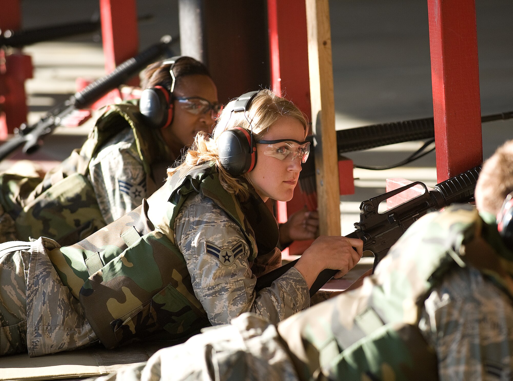 Airman 1st Class Jamie Horner, Tops in Blue member from the 316th Civil Engineer Squadron, Andrews Air Force Base, Md., waits for instructions during a weapons qualification at Dover Air Force Base, Del., Nov. 22, 2010. (U.S. Air Force photo by Jason Minto/Released)