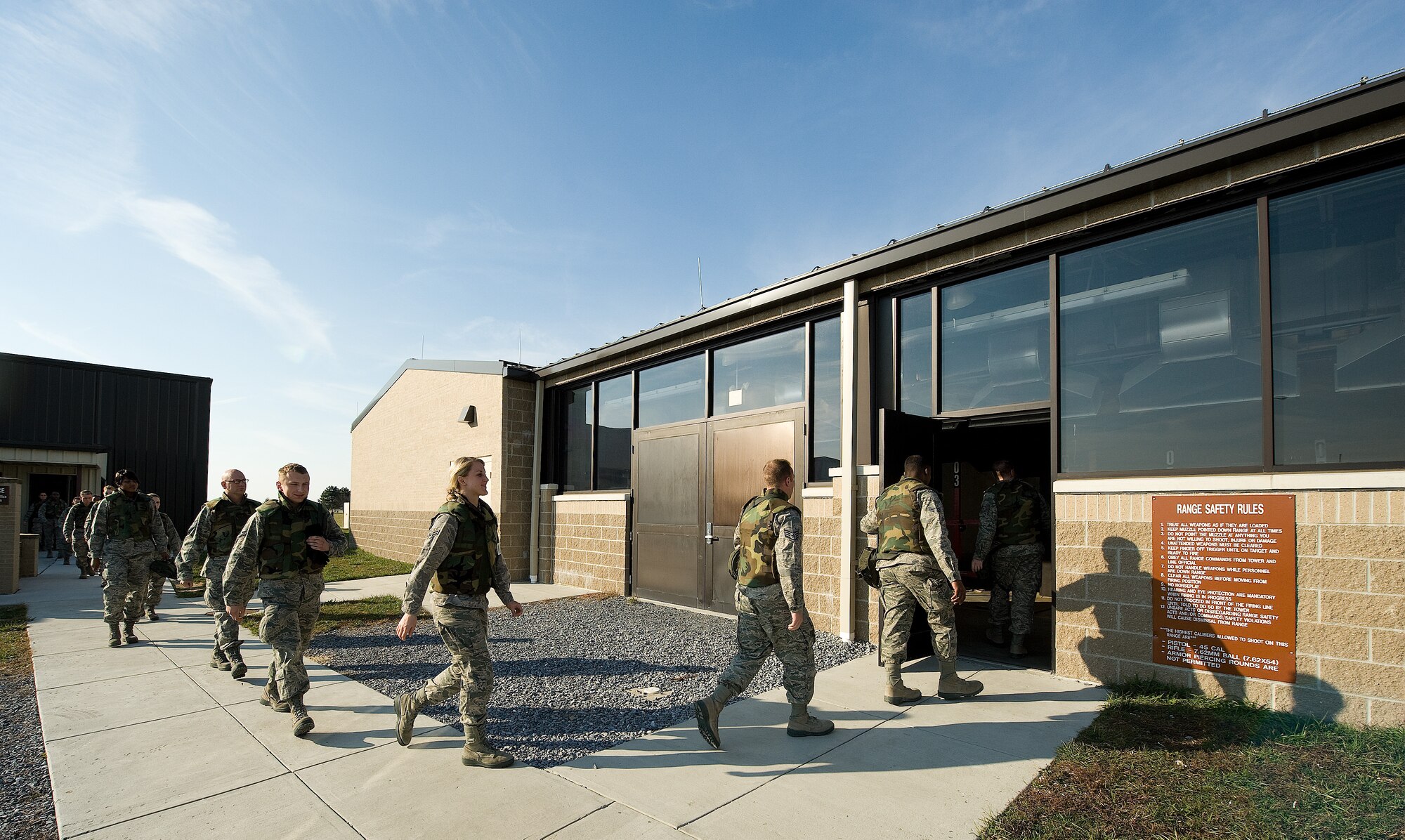 Tops in Blue members file into the Dover Air Force Base, Del., combat arms firing range during a weapon qualification Nov. 22, 2010, to qualify on their weapons before heading to perform downrange.(U.S. Air Force photo by Jason Minto/Released)