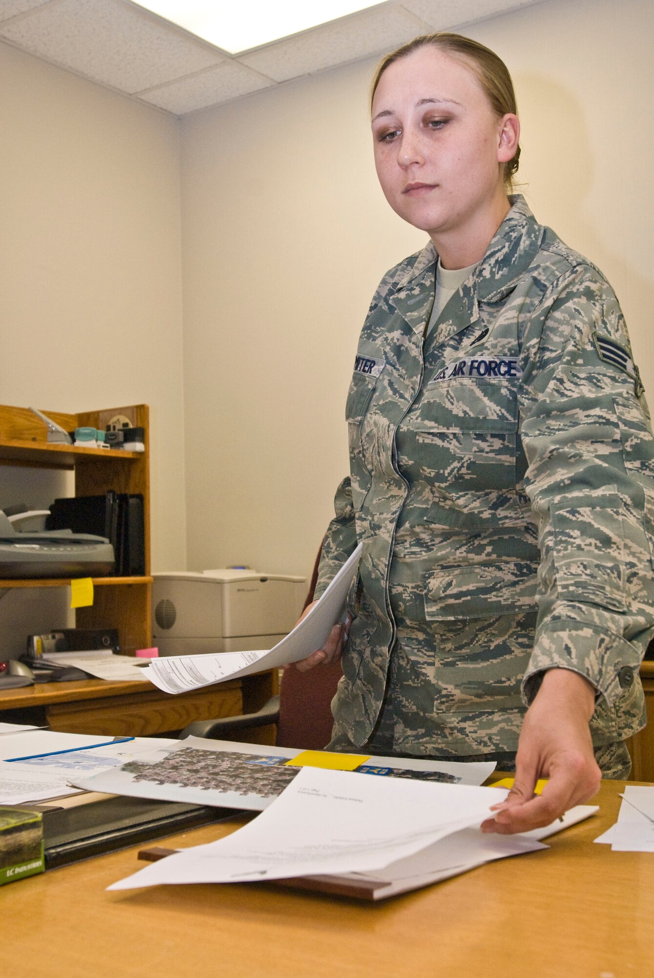 Senior Airman Jamie Palmiter, an Area Defense Counsel defense paralegal, prepares a package for an upcoming case Nov. 4, 2010, at Little Rock Air Force Base, Ark. The Dayton, Ohio, native mentored clients on dress and appearance, and standards of conduct during courts-martial. (U.S. Air Force photo by Staff Sgt. Nestor Cruz)