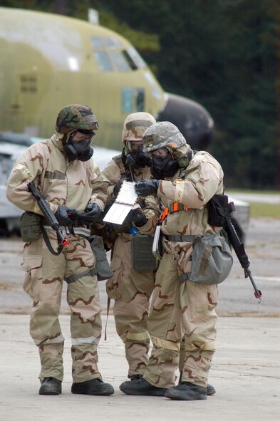 Airmen from the Expeditionary Depot Maintenance Flight at Robins Air Force Base, Ga., perform a post-attack reconnaissance sweep of their work area after a simulated attack. (U.S. Air Force photo/Sue Sapp)
