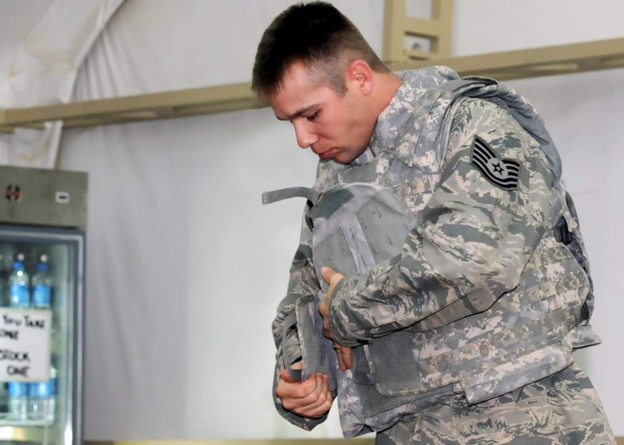 Tech. Sgt. Robert McVickers, an Airman deploying to Iraq, prepares to go through Mine Resistant Ambush Protected vehicle training with the 467th Air Expeditionary Group at an undisclosed air base in Southwest Asia Nov. 16, 2010. With the activation of the 467th AEG, Nov. 12, the group commander now has full administrative and operational control over Individual Augmentee, or IA, Airmen along with the joint expeditionary tasked, or JET, Airmen they already had ADCON and OPCON of in the Iraq Joint Operations Area. (U.S. Air Force photo by Senior Airman Laura Turner / Released)