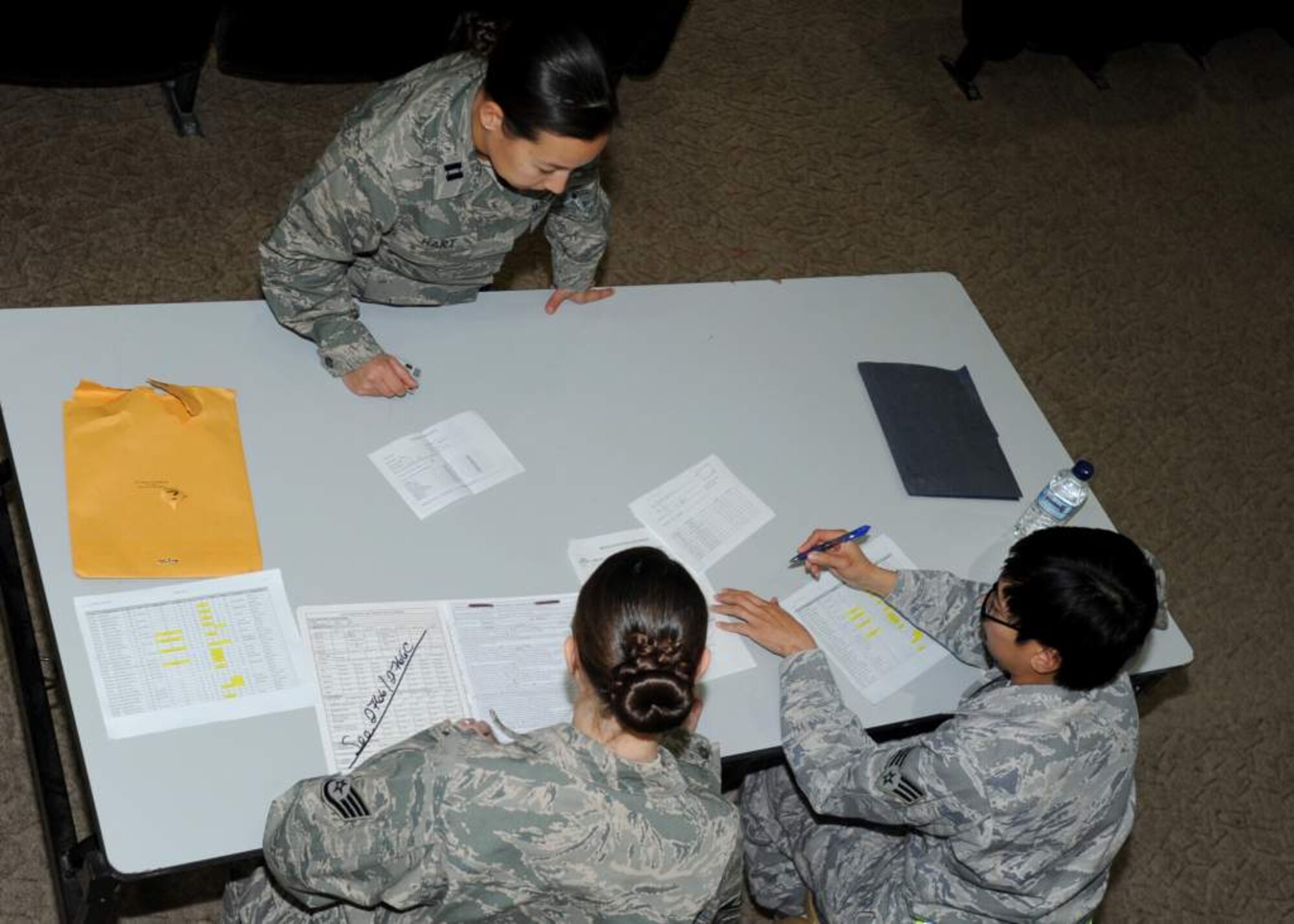 Capt. Kareen Hart, an Airman deploying to Iraq, processes through medical readiness with the 467th Air Expeditionary Group at an undisclosed air base in Southwest Asia Nov. 16, 2010. With the activation of the 467th AEG, Nov. 12, the group commander now has full administrative and operational control over Individual Augmentee, or IA, Airmen along with the joint expeditionary tasked, or JET, Airmen they already had ADCON and OPCON of in the Iraq Joint Operations Area. (U.S. Air Force photo by Senior Airman Laura Turner / Released)