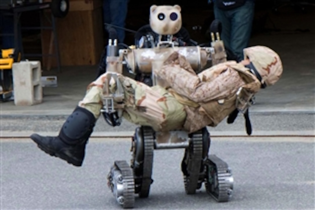 An all-terrain, search-and-rescue humanoid robot simulates how a soldier or item up to 500 pounds can be lifted and carried, and how it can grasp fragile objects without damaging them at Fort Detrick, Md., Nov. 22, 2010.